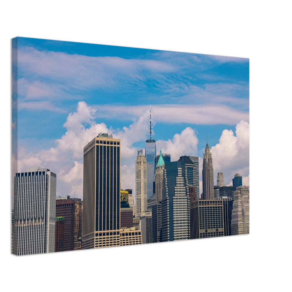 The steel-and-glass architecture and the softness of the clouds above.